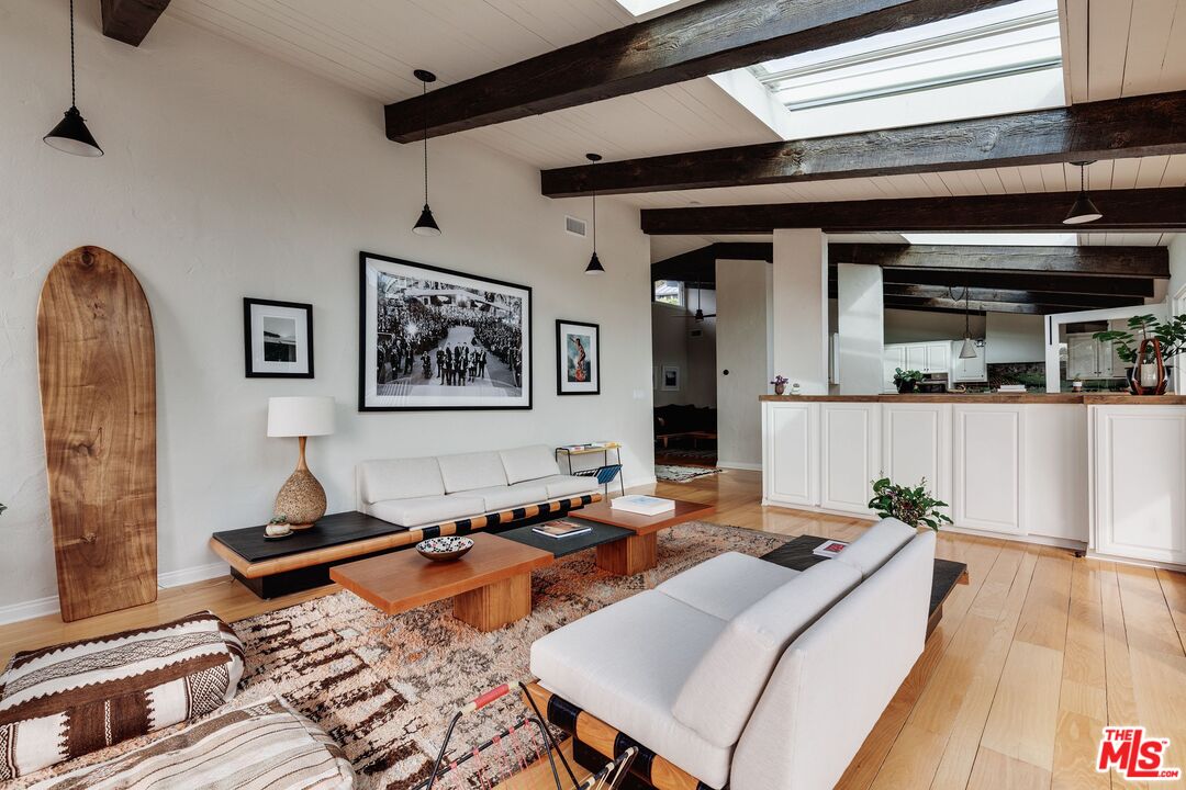 3629 Serra Road Malibu, CA 90265 - Photo 5 of 26 a living room with furniture and wooden floor