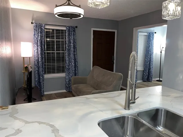 a kitchen with a refrigerator and a sink