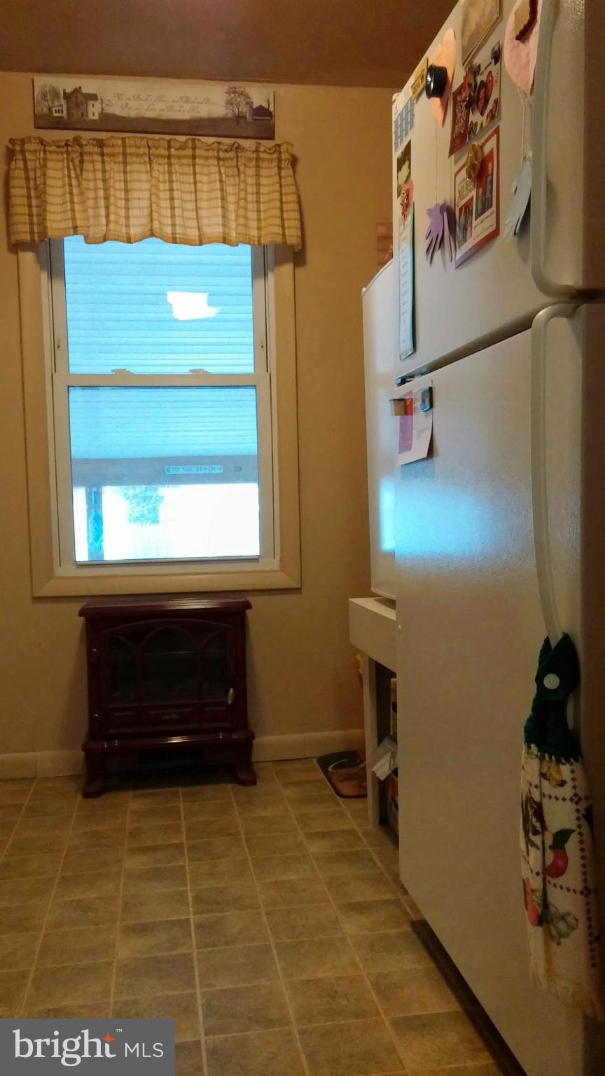 196 Pike Road Pasadena, MD 21122 - Photo 11 of 30 Kitchen fridge and pantry area