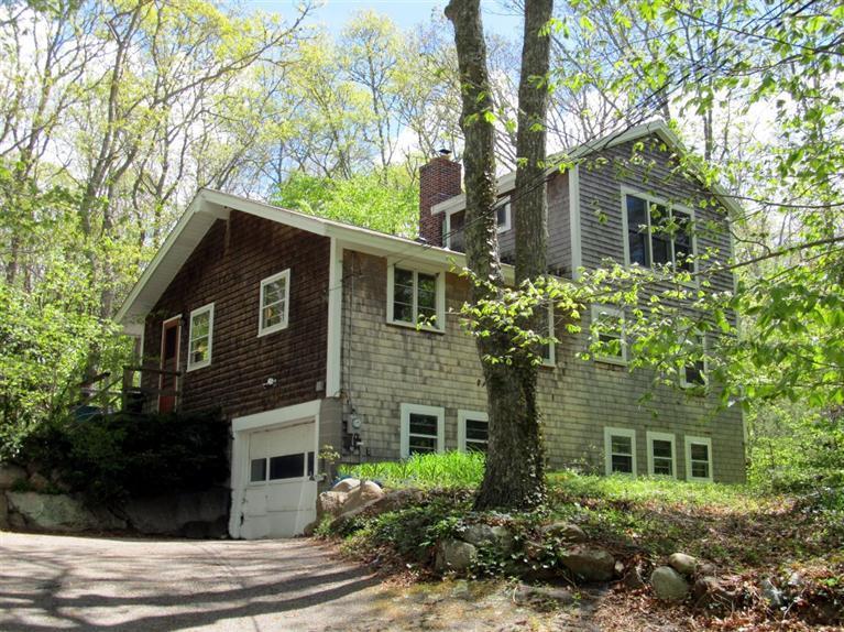 52 F R Lillie Road Woods Hole, MA 02543 - Photo 1 of 17 a front view of a house with a garden