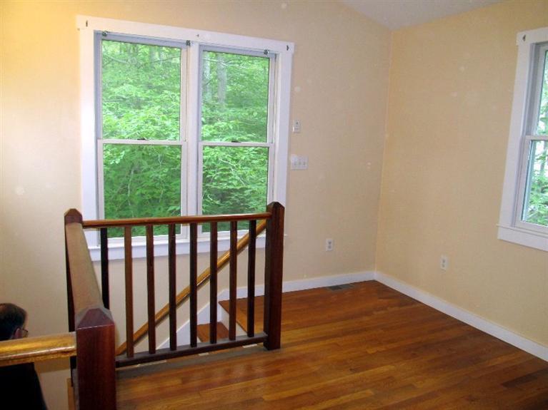 52 F R Lillie Road Woods Hole, MA 02543 - Photo 11 of 17 a view of a wooden floor and a window