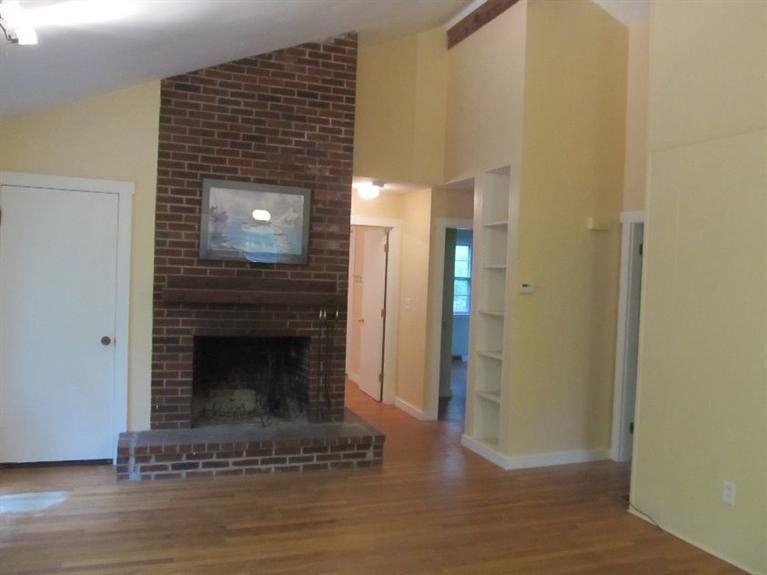 52 F R Lillie Road Woods Hole, MA 02543 - Photo 4 of 17 a living room with a fireplace
