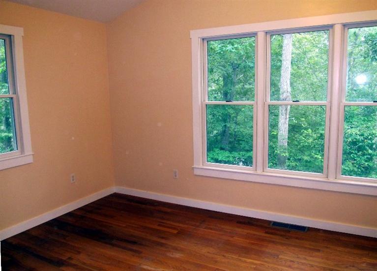 52 F R Lillie Road Woods Hole, MA 02543 - Photo 8 of 17 a view of a small space with wooden floor and a window