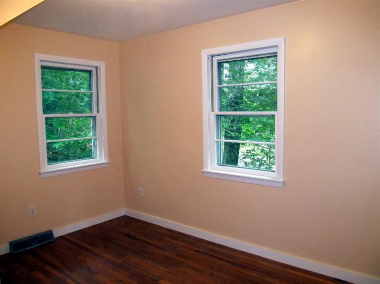 52 F R Lillie Road Woods Hole, MA 02543 - Photo 9 of 17 an empty room with wooden floor and windows