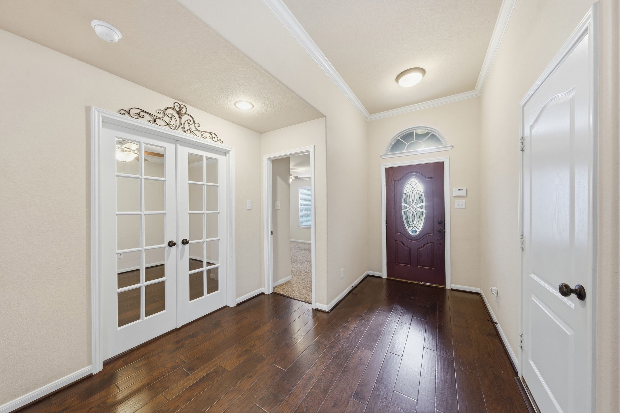 7611 Willow School Drive Spring, TX 77389 - Photo 4 of 23 wooden floor in an empty room with a window