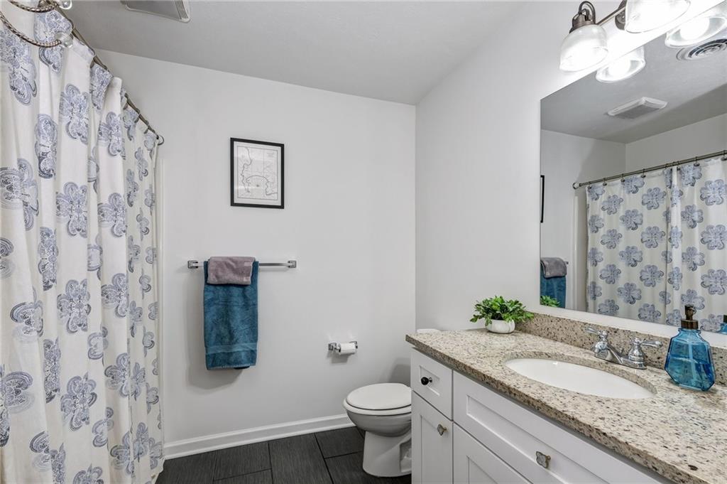 3622 Smallman Street Pittsburgh, PA 15201 - Photo 17 of 25 The hall bathroom has granite countertop and pretty tile floors. There is a shower tub combo and neutral colors!