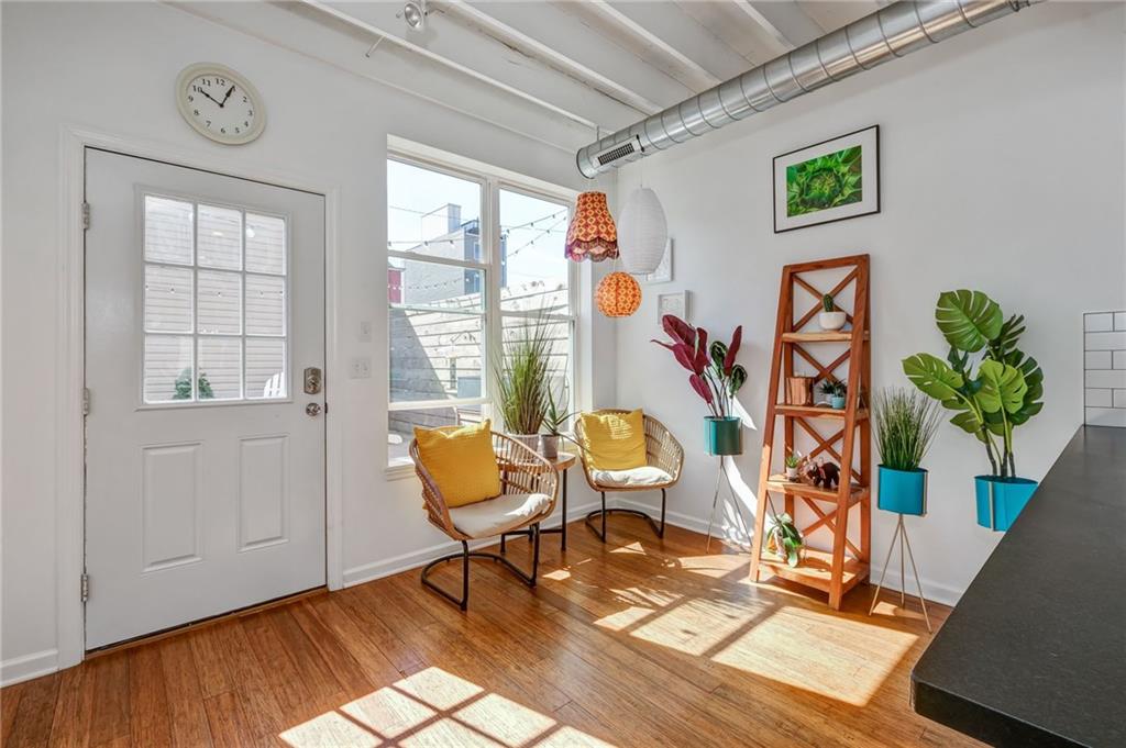 3622 Smallman Street Pittsburgh, PA 15201 - Photo 10 of 25 RARE! This home has an eat-in kitchen nook which also doubles as a sitting area. This room floods with light and is perfect for plants! The rear door opens to the homes paver patio which is private. The detached garage is in the rear of the home too.