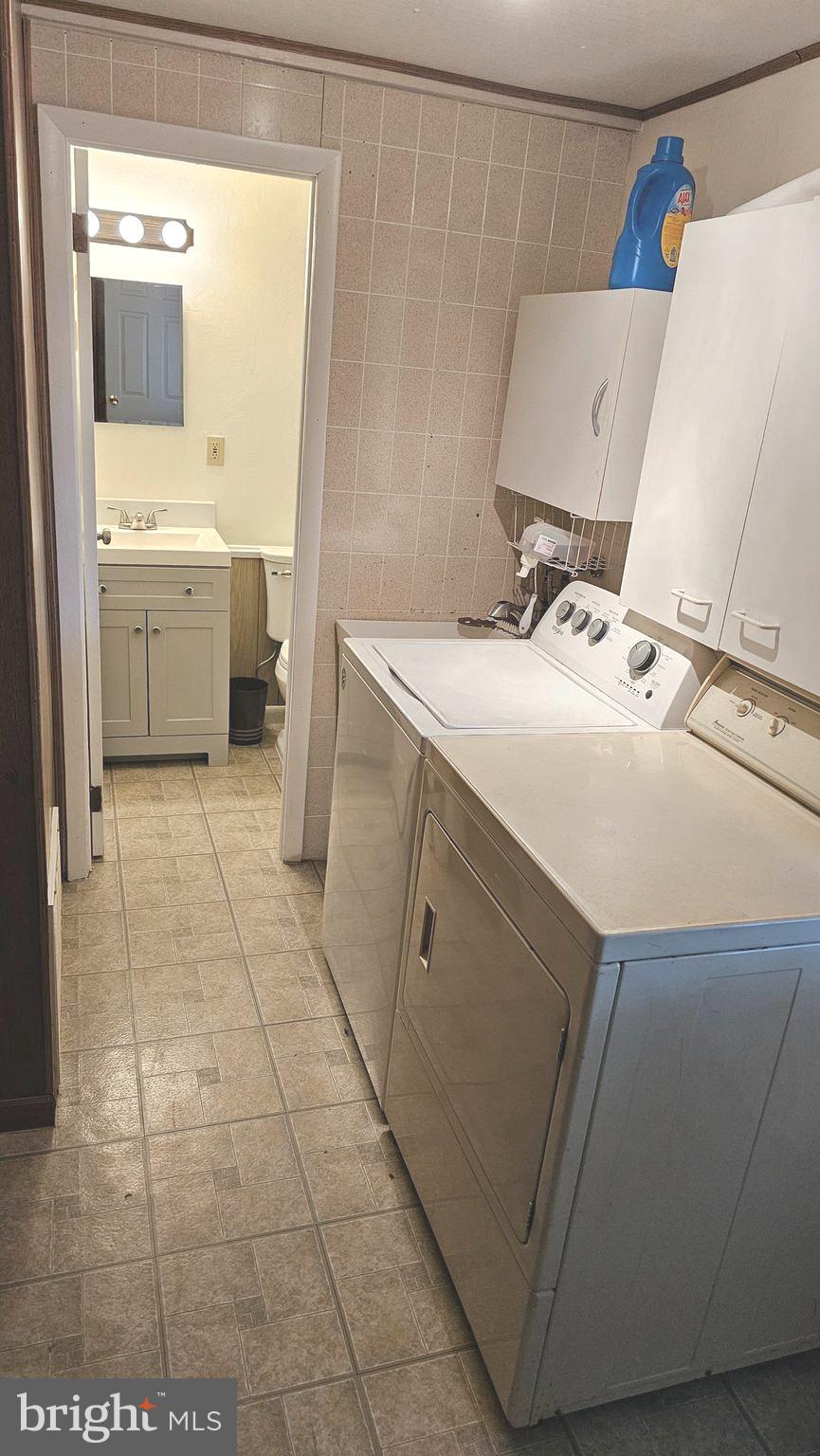 125 Colonial Road Edgewater Park, NJ 08010 - Photo 35 of 43 Half Bathroom and Laundry Area