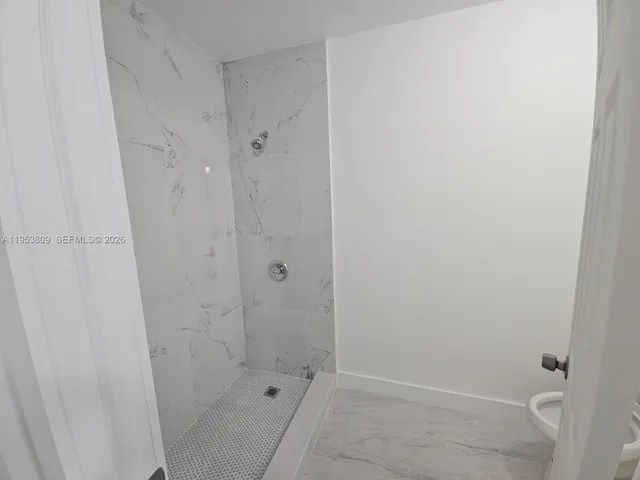 a bathroom with a sink and shower