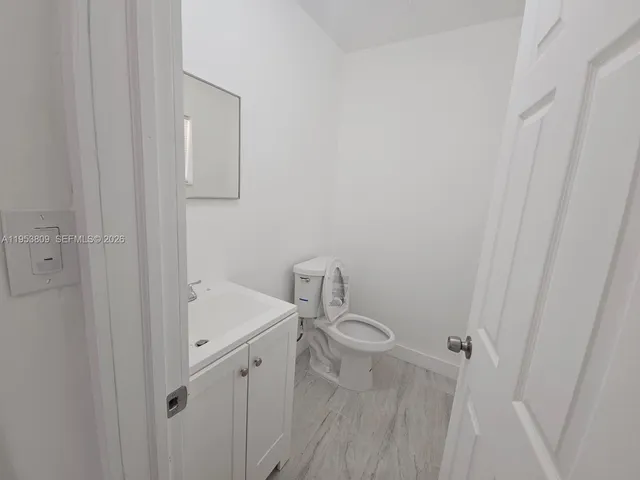 a bathroom with a sink and toilet
