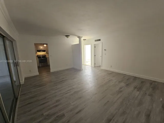 a view of a livingroom with wooden floor