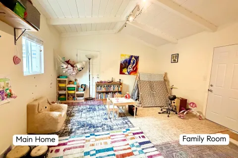 a kitchen with a refrigerator and a stove top oven