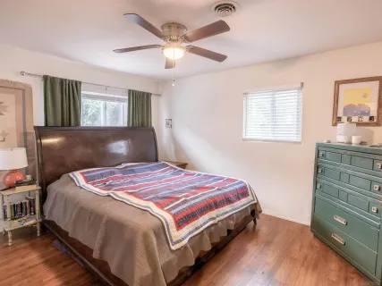 a bed room with a bed and a window