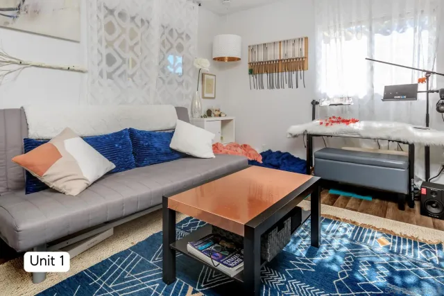 a bathroom with a granite countertop sink a mirror and a shower