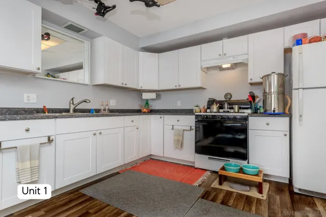 a living room with furniture a window and a flat screen tv