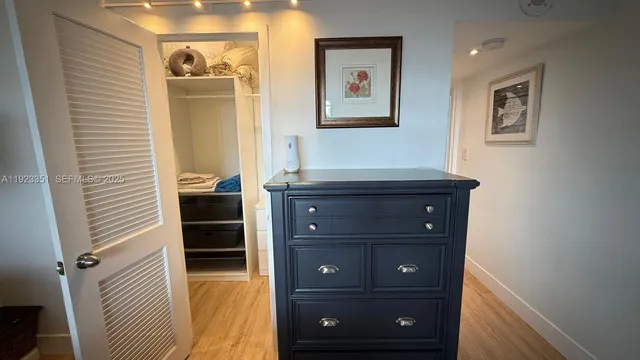 a room with a dresser and a mirror