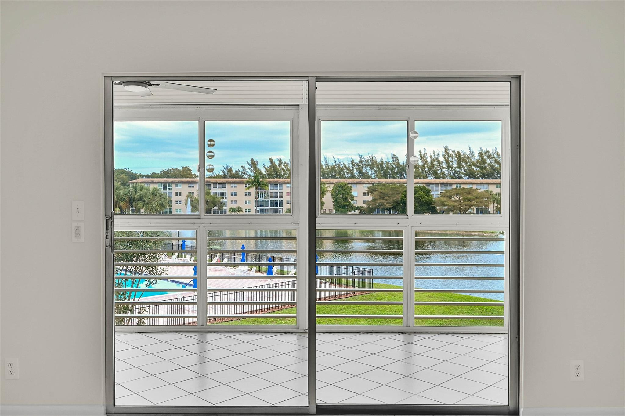 1804 Eleuthera Point, Unit E3 Coconut Creek, FL 33066 - Photo 1 of 41 a room with a large window