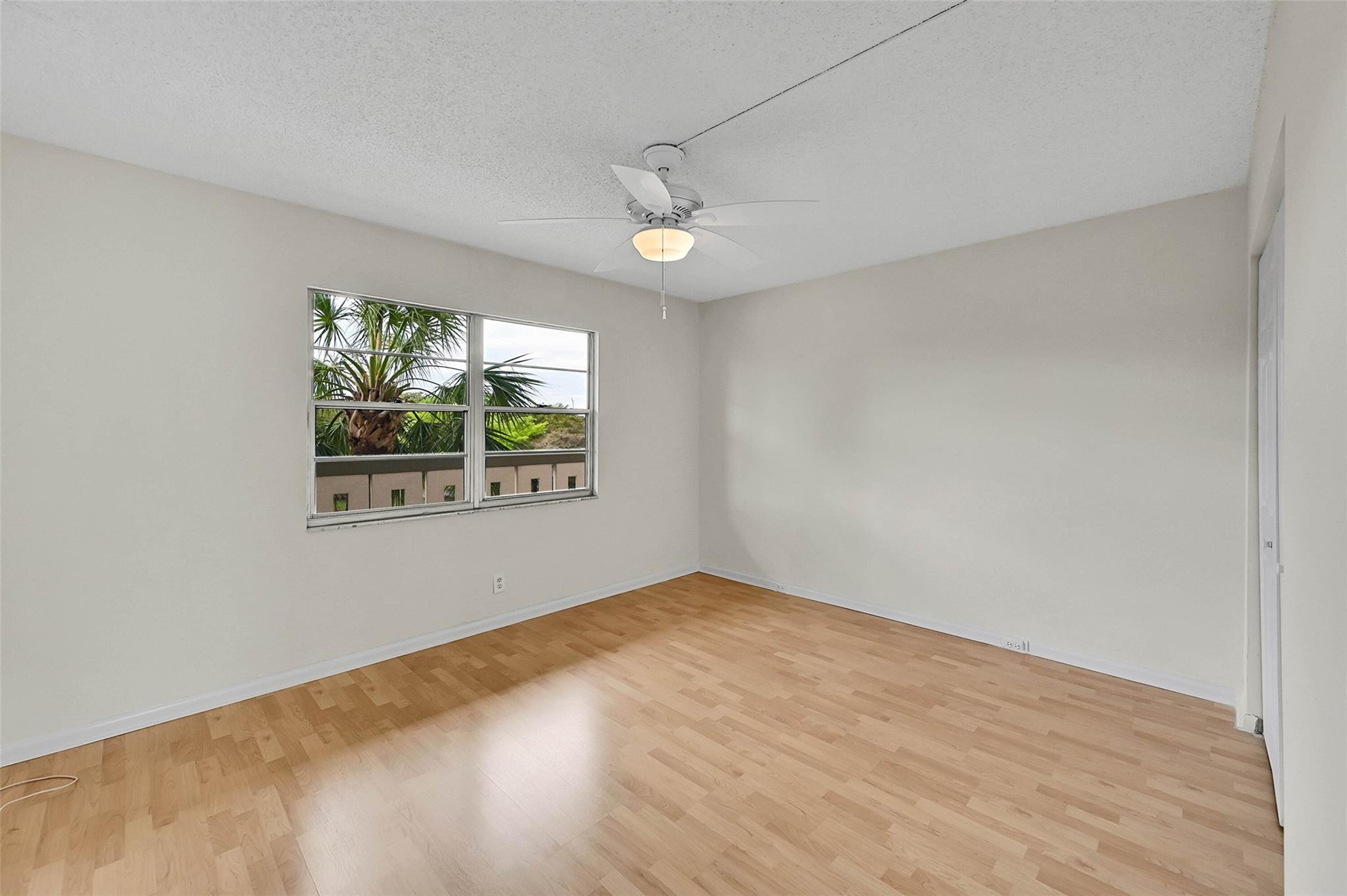 1804 Eleuthera Point, Unit E3 Coconut Creek, FL 33066 - Photo 22 of 41 an empty room with windows