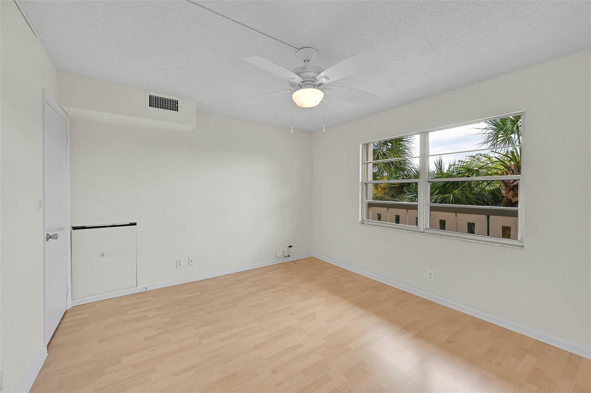 1804 Eleuthera Point, Unit E3 Coconut Creek, FL 33066 - Photo 23 of 41 a view of an empty room with a window