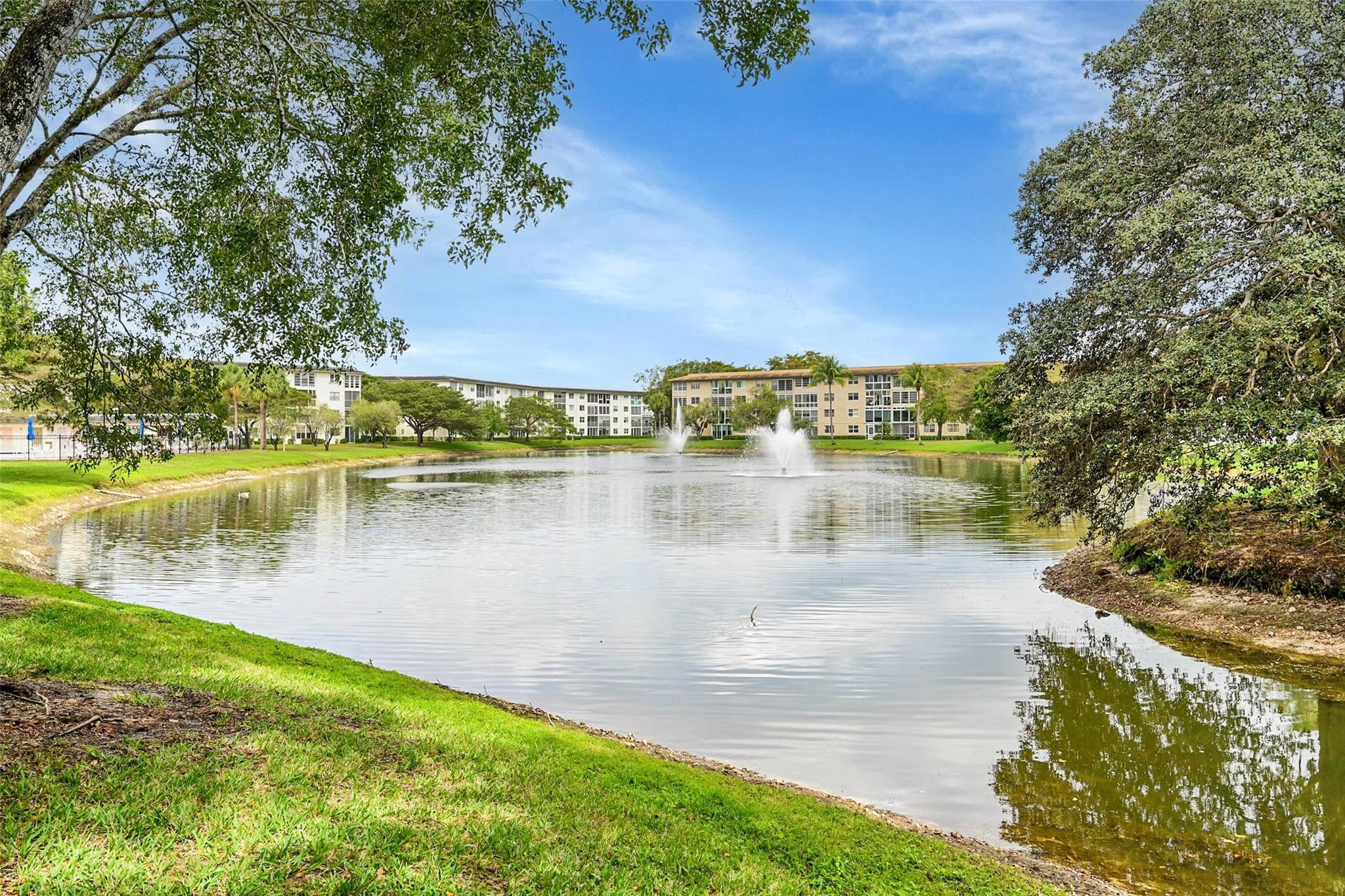 1804 Eleuthera Point, Unit E3 Coconut Creek, FL 33066 - Photo 37 of 41 a view of a lake view with houses in back