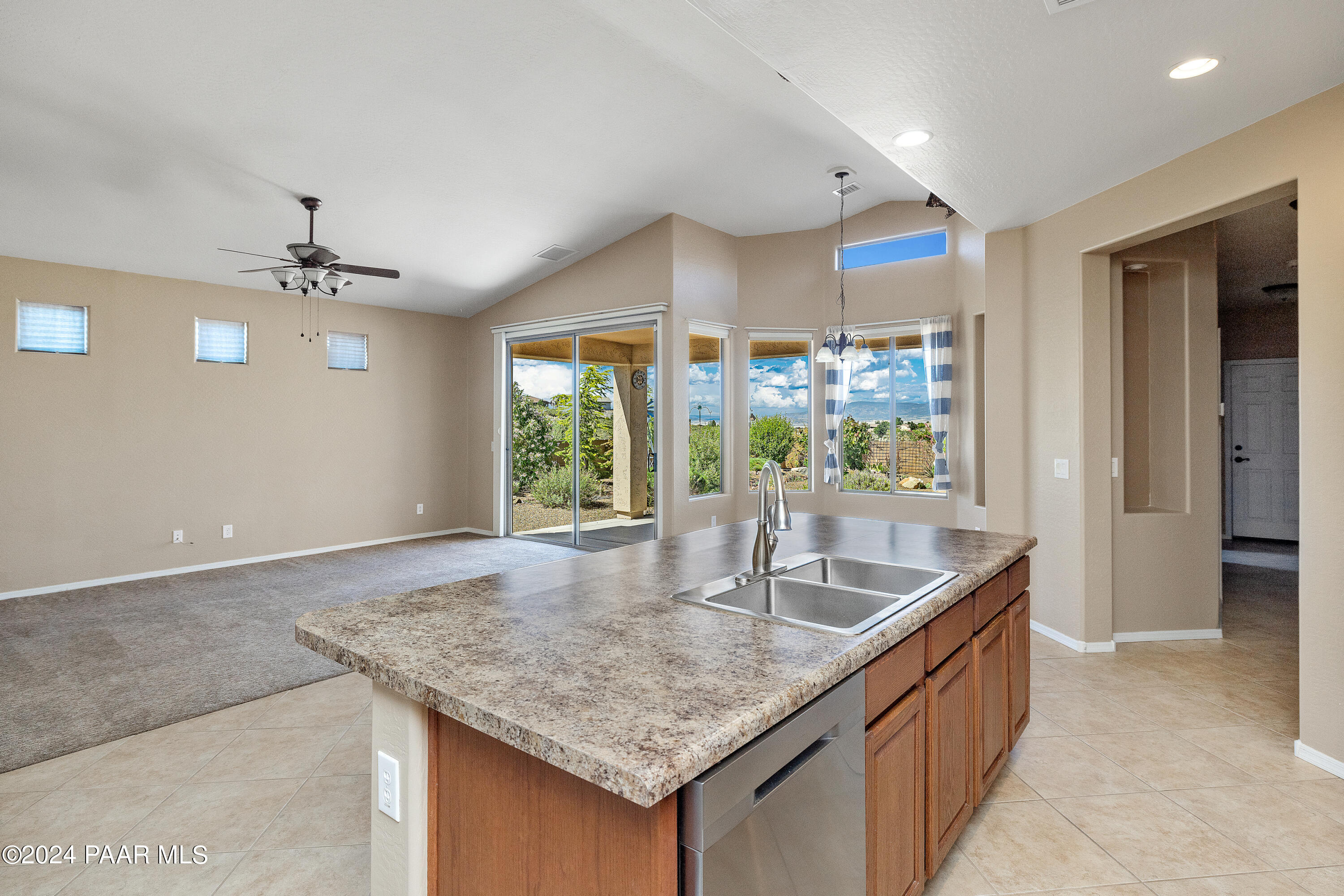 1195 Rigo Ranch Road Prescott Valley, AZ 86314 - Photo 8 of 65 a kitchen with granite countertop a sink and a window