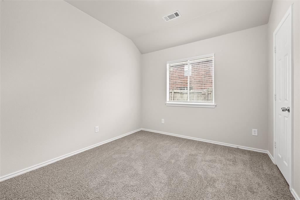 7928 Hill Country Lane Dallas, TX 75249 - Photo 13 of 19 an empty room with a window