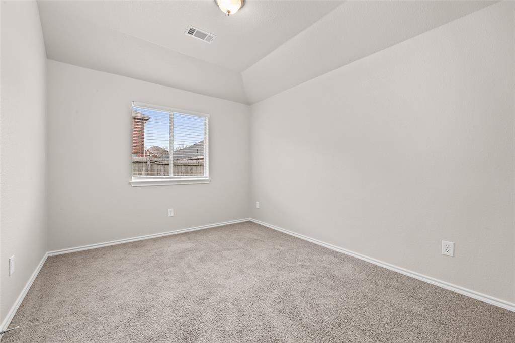 7928 Hill Country Lane Dallas, TX 75249 - Photo 16 of 19 an empty room with windows