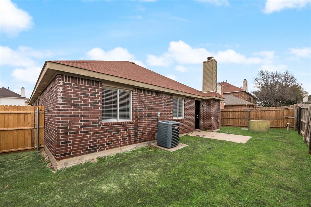 7928 Hill Country Lane Dallas, TX 75249 - Photo 17 of 19 a front view of a house with garden