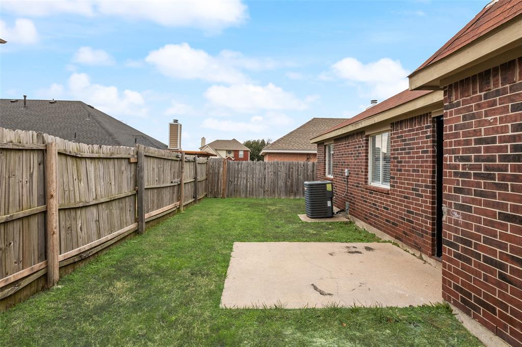 7928 Hill Country Lane Dallas, TX 75249 - Photo 18 of 19 a backyard of a house with lots of green space