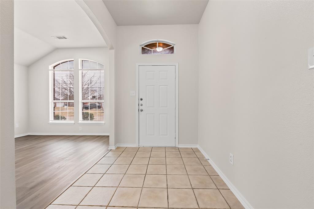 7928 Hill Country Lane Dallas, TX 75249 - Photo 3 of 19 an empty room with windows