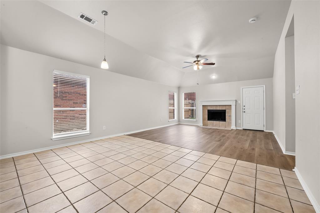 7928 Hill Country Lane Dallas, TX 75249 - Photo 8 of 19 a view of an empty room with a fireplace