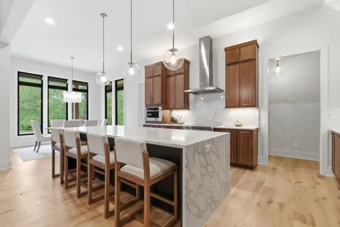 a stove top oven sitting inside of a kitchen