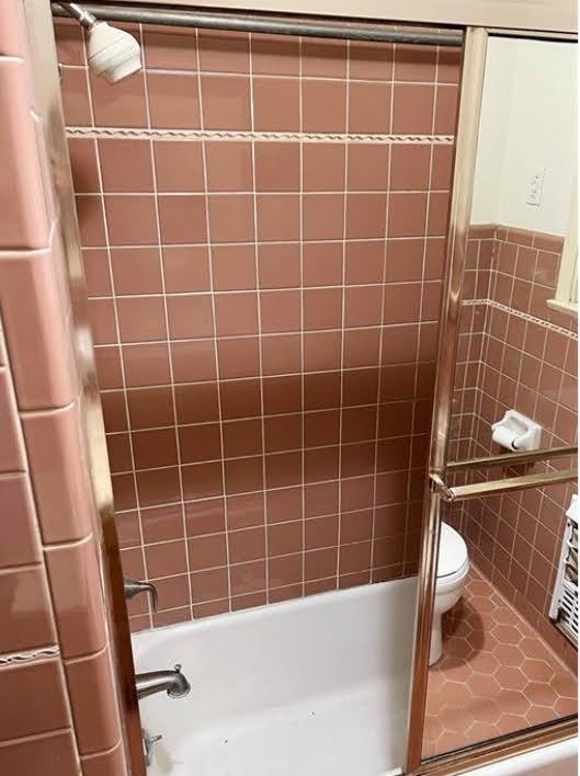 809 North 8th Street Temple, TX 76501 - Photo 13 of 20 A well-maintained tub-shower combination features classic tilework, perfect for daily routines.