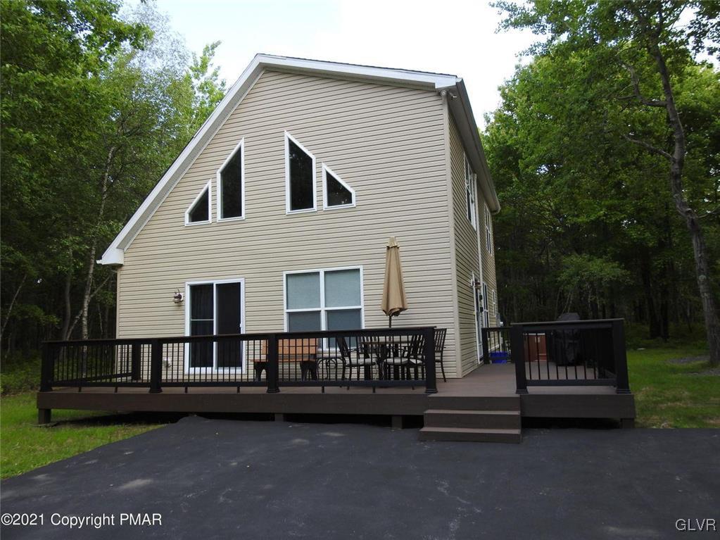 1170 Boulder Road Blakeslee, PA 18610 - Photo 1 of 46 a view of a house with a deck and a garden