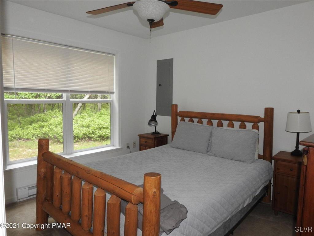 1170 Boulder Road Blakeslee, PA 18610 - Photo 17 of 46 a bed sitting in a bedroom next to a window
