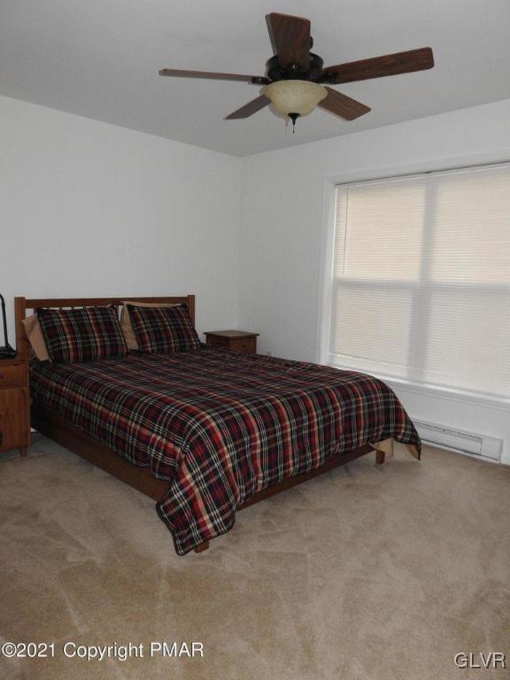 1170 Boulder Road Blakeslee, PA 18610 - Photo 33 of 46 a bedroom with a bed and window