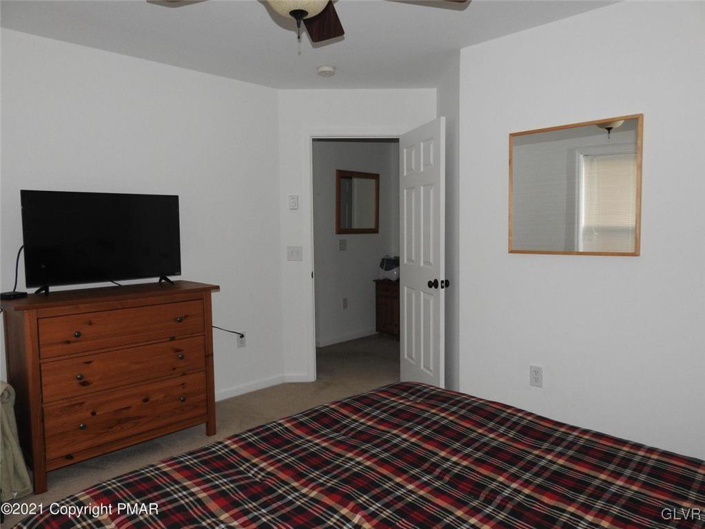 1170 Boulder Road Blakeslee, PA 18610 - Photo 35 of 46 a bedroom with a bed and flat screen tv