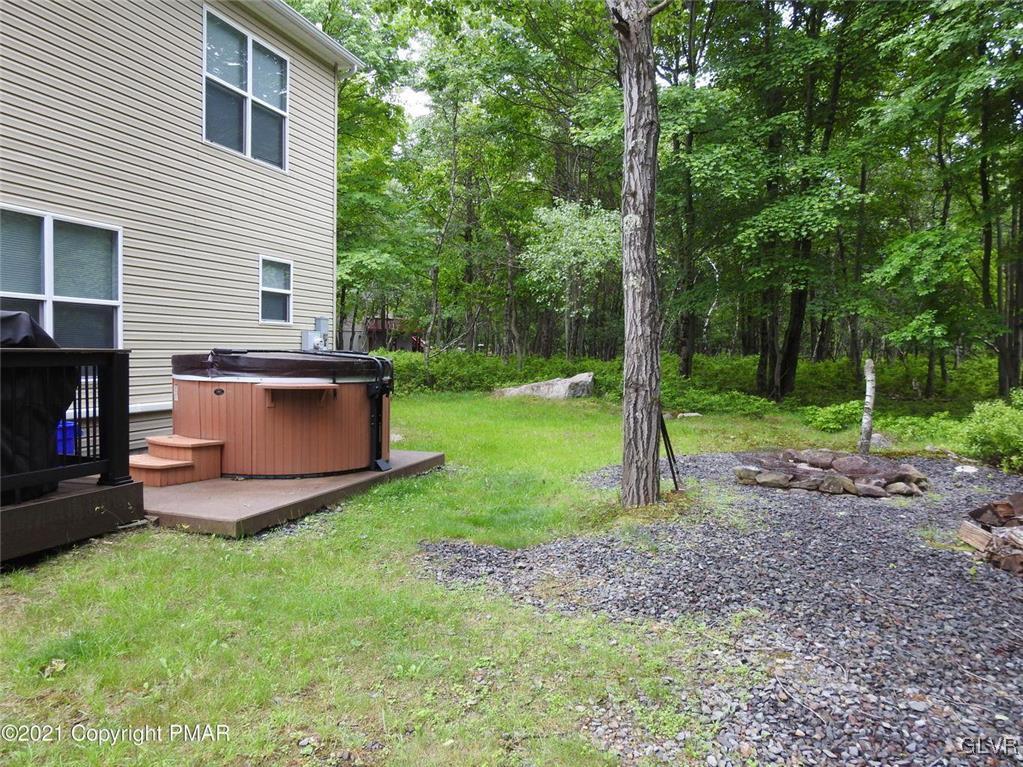1170 Boulder Road Blakeslee, PA 18610 - Photo 5 of 46 a view of a backyard with plants and large trees