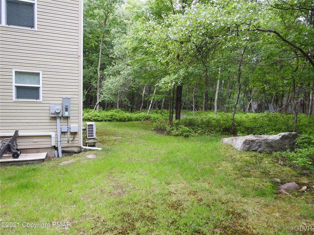 1170 Boulder Road Blakeslee, PA 18610 - Photo 6 of 46 a view of a chair and table in backyard of the house