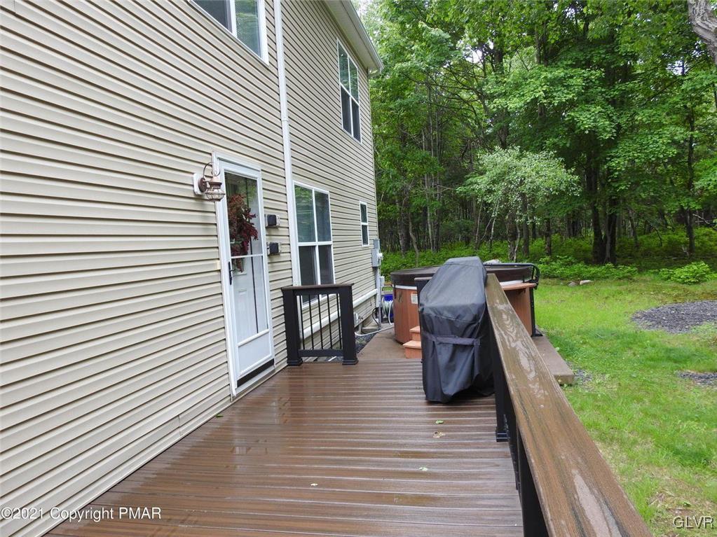 1170 Boulder Road Blakeslee, PA 18610 - Photo 8 of 46 a view of a patio with dining table and chairs