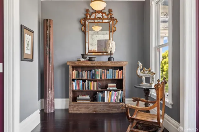 a view of a dining room with furniture window and wooden floor