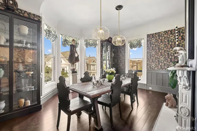 a kitchen with a table chairs and microwave