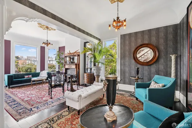 a living room with furniture a clock and a large window