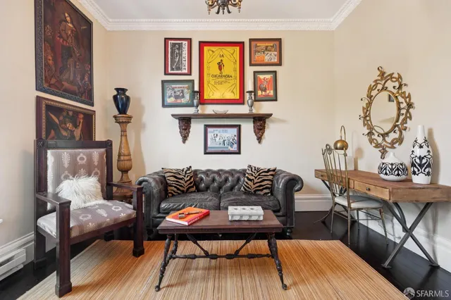 a living room with furniture and a chandelier