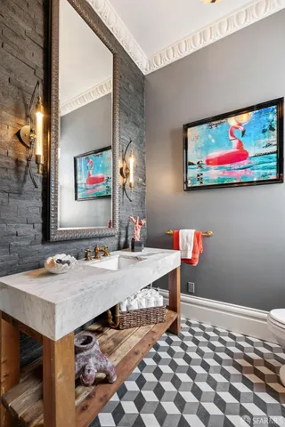 a spacious bedroom with a bed and a chandelier