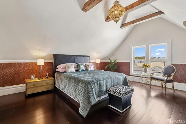 a dining room with furniture and wooden floor