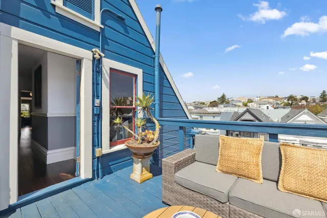 a bathroom with a granite countertop sink vanity mirror and toilet