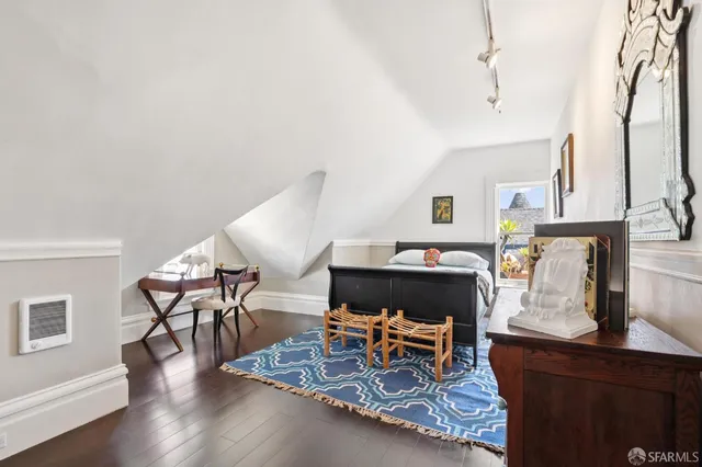 a living room with fireplace furniture and a chandelier