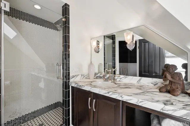 a kitchen with a stove a refrigerator and a window