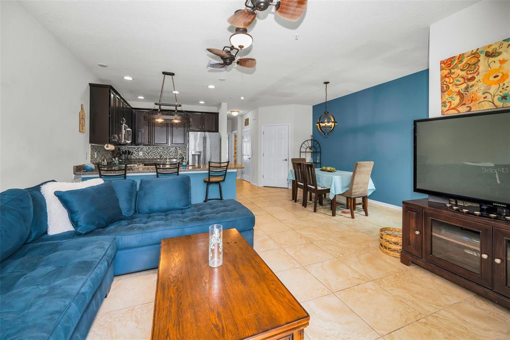 5529 White Marlin Court New Port Richey, FL 34652 - Photo 17 of 63 a living room with stainless steel appliances furniture and a flat screen tv